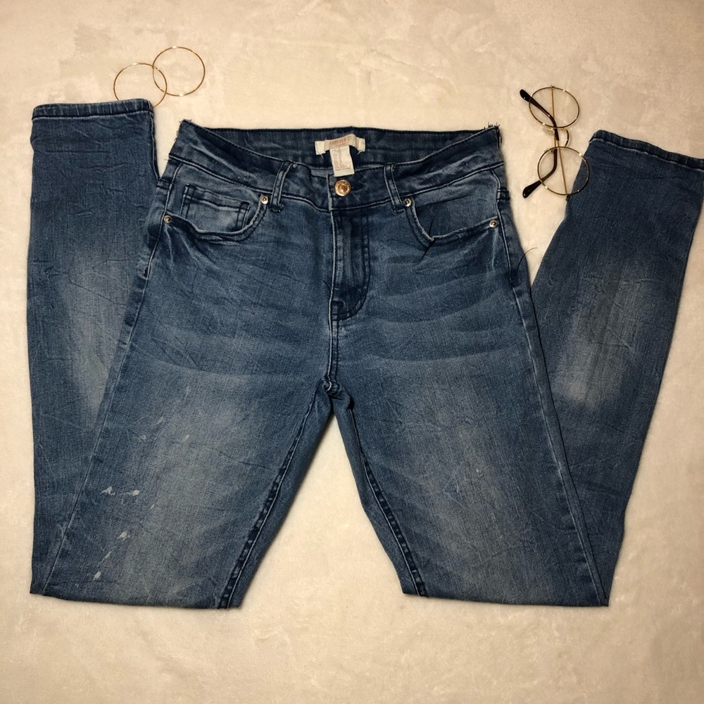 Distressed Mid Rise skinny jeans